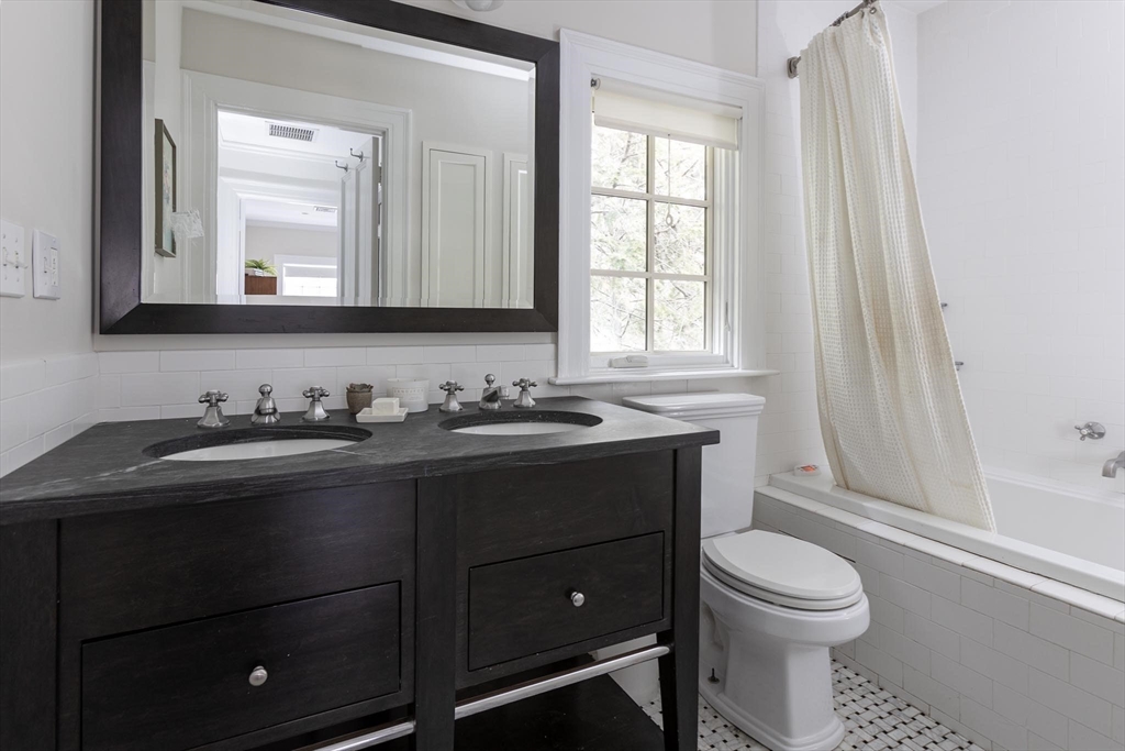 57 Hedge Road Brookline, MA 02445 - Photo 23 of 37 a bathroom with a sink vanity mirror and toilet