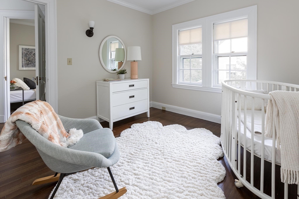 57 Hedge Road Brookline, MA 02445 - Photo 24 of 37 a bedroom with furniture and a window