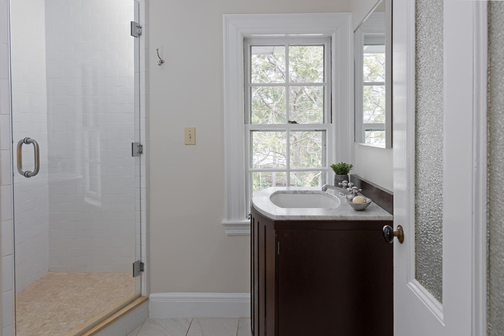 57 Hedge Road Brookline, MA 02445 - Photo 26 of 37 a bathroom with a sink a toilet and shower