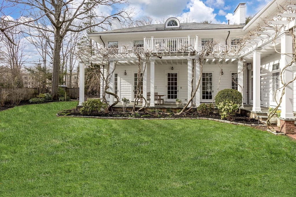 57 Hedge Road Brookline, MA 02445 - Photo 3 of 37 a front view of a house with a yard