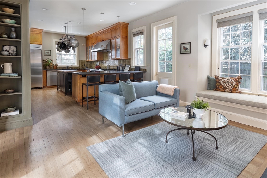 57 Hedge Road Brookline, MA 02445 - Photo 4 of 37 a living room with furniture kitchen view and a large window