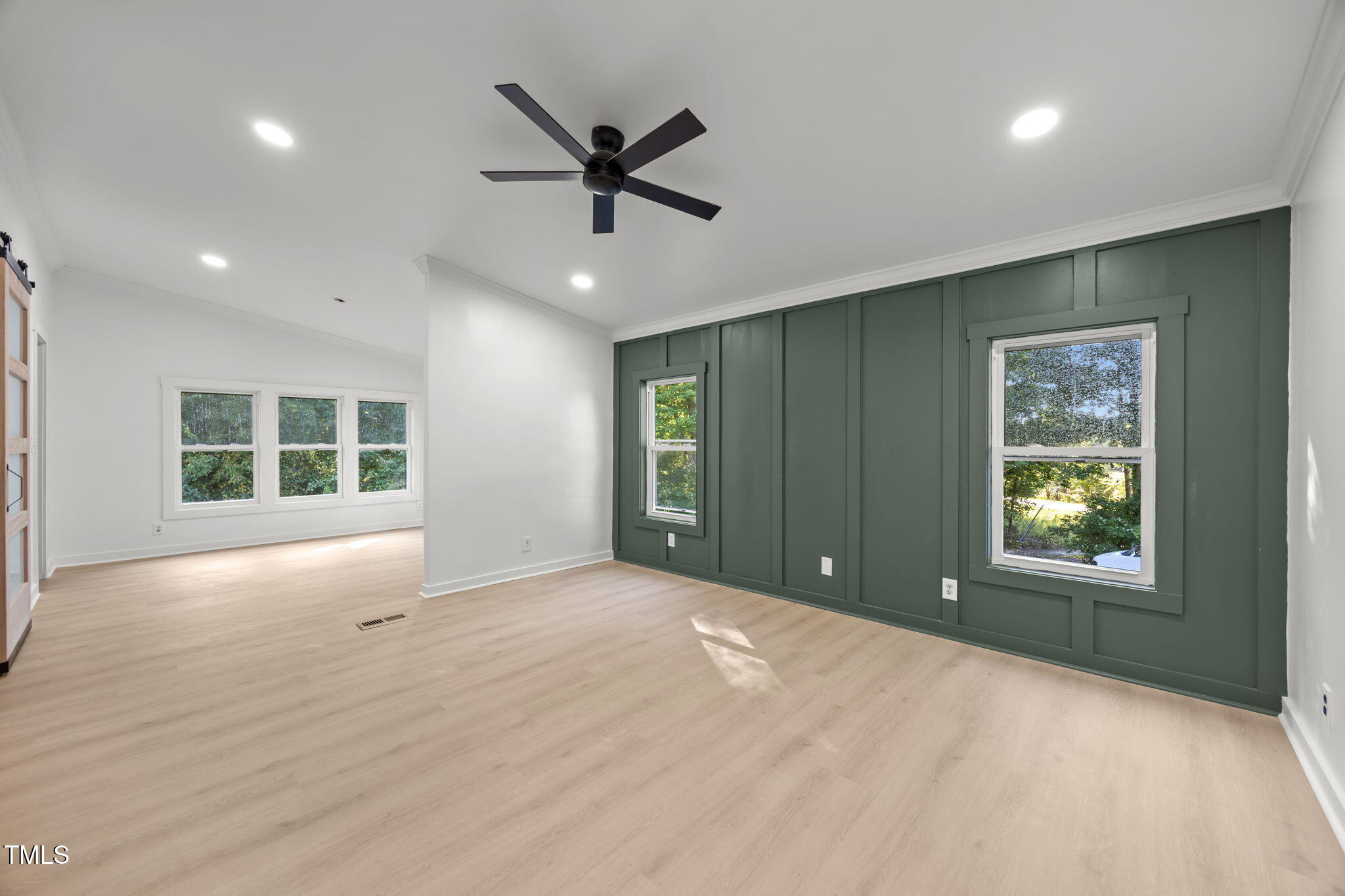 2309 Win Road Garner, NC 27529 - Photo 13 of 35 a view of an empty room with a window and a kitchen
