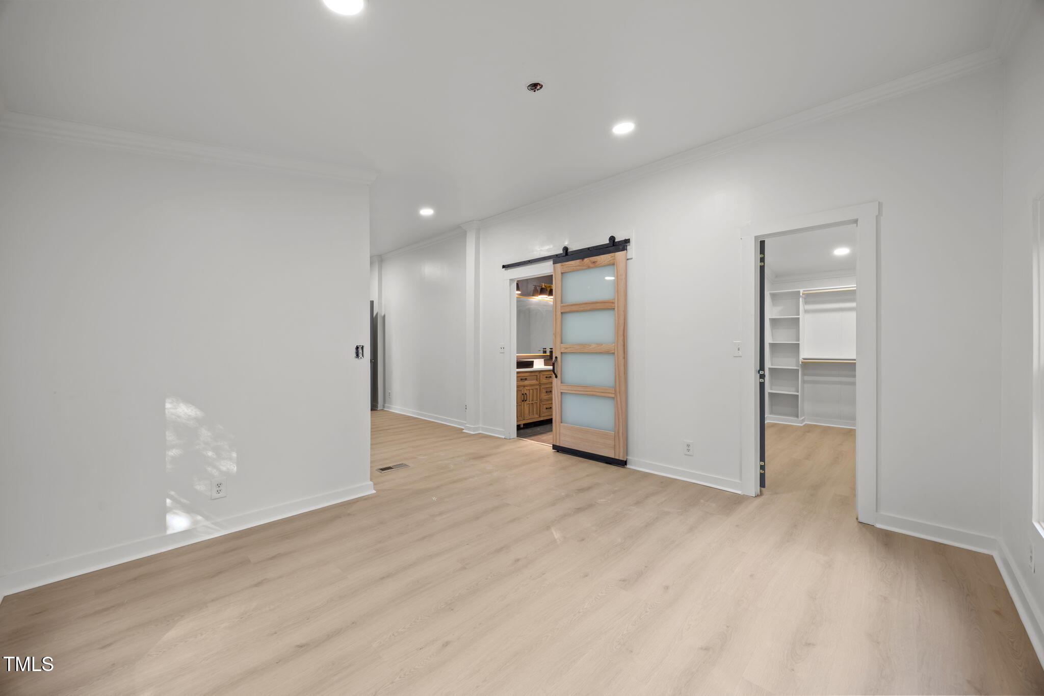 2309 Win Road Garner, NC 27529 - Photo 16 of 35 an empty room with closet and bathroom