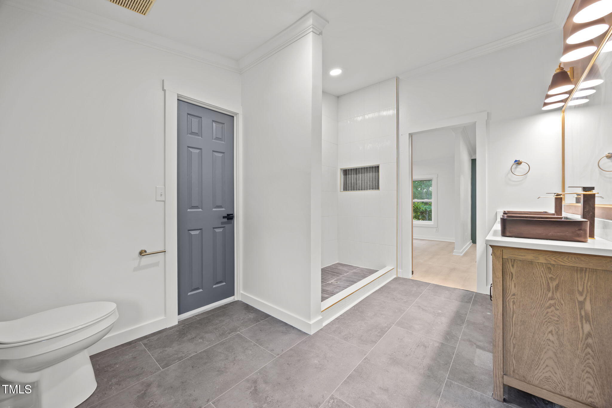 2309 Win Road Garner, NC 27529 - Photo 18 of 35 a bathroom with a sink a toilet and shower