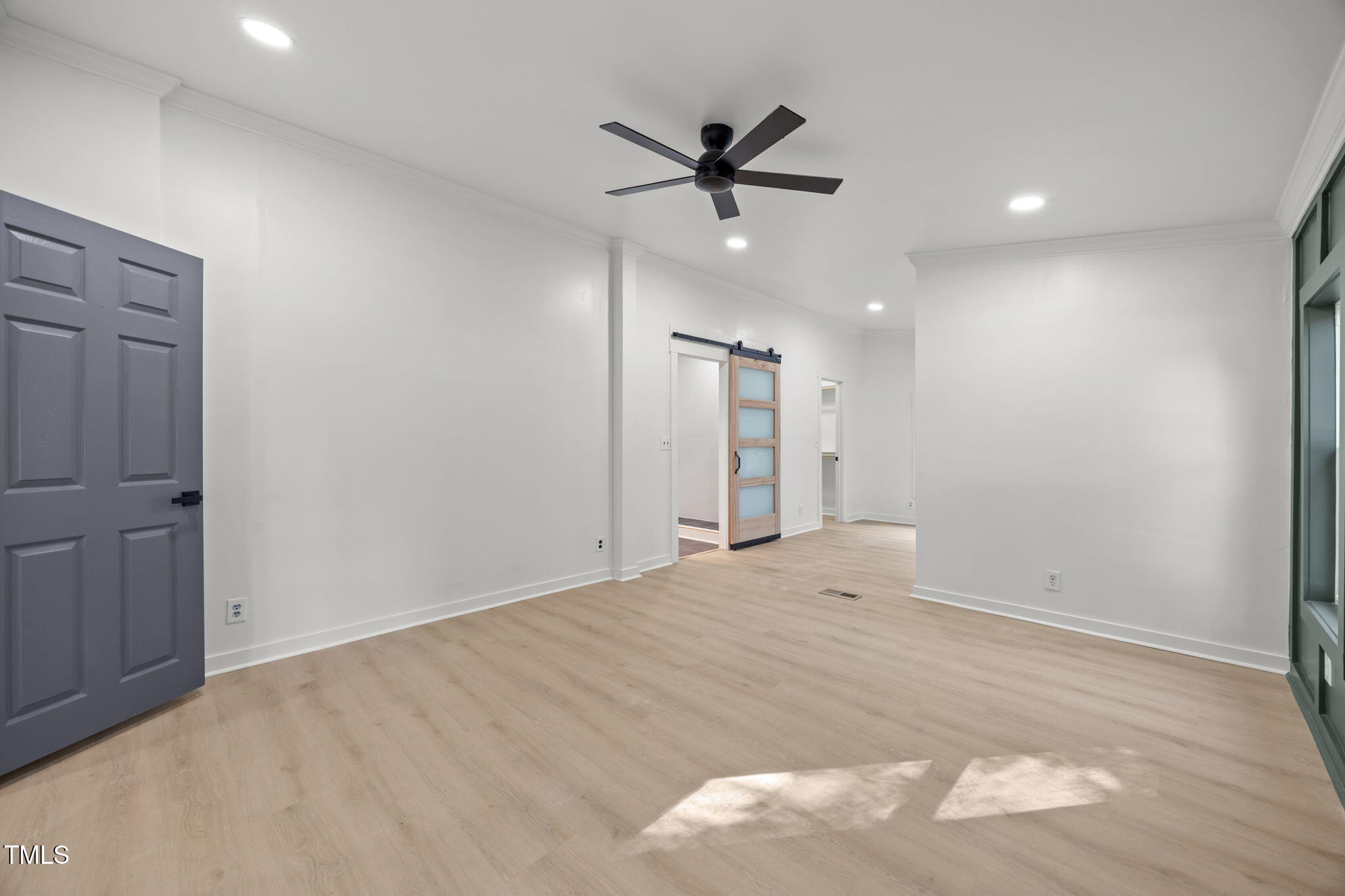 2309 Win Road Garner, NC 27529 - Photo 21 of 35 a view of empty room with wooden floor and ceiling fan