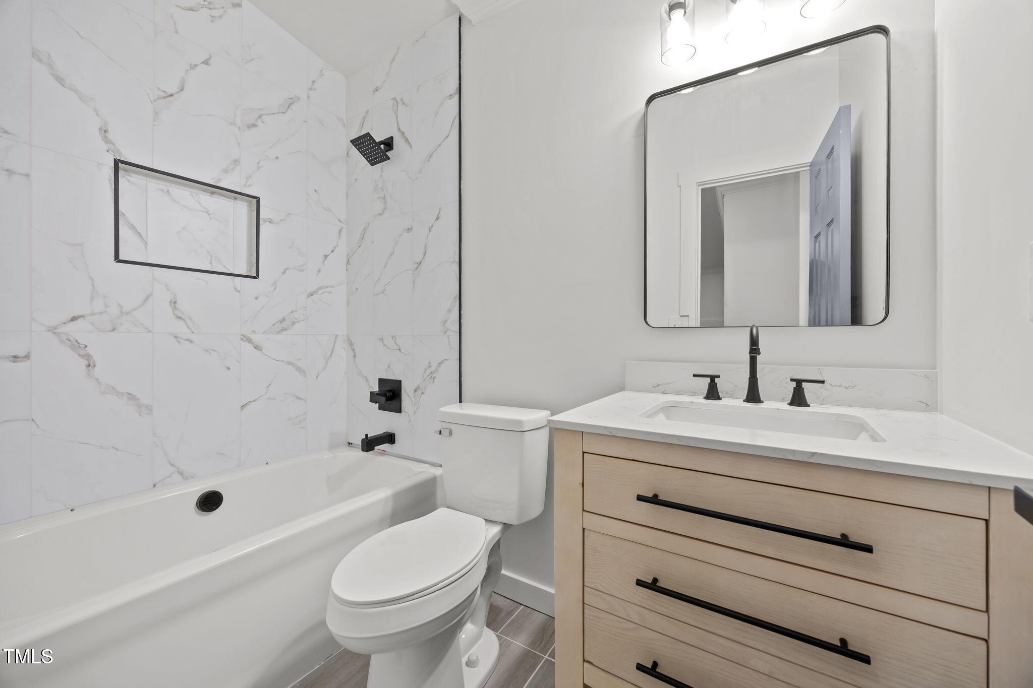 2309 Win Road Garner, NC 27529 - Photo 28 of 35 a bathroom with a sink a toilet and a mirror