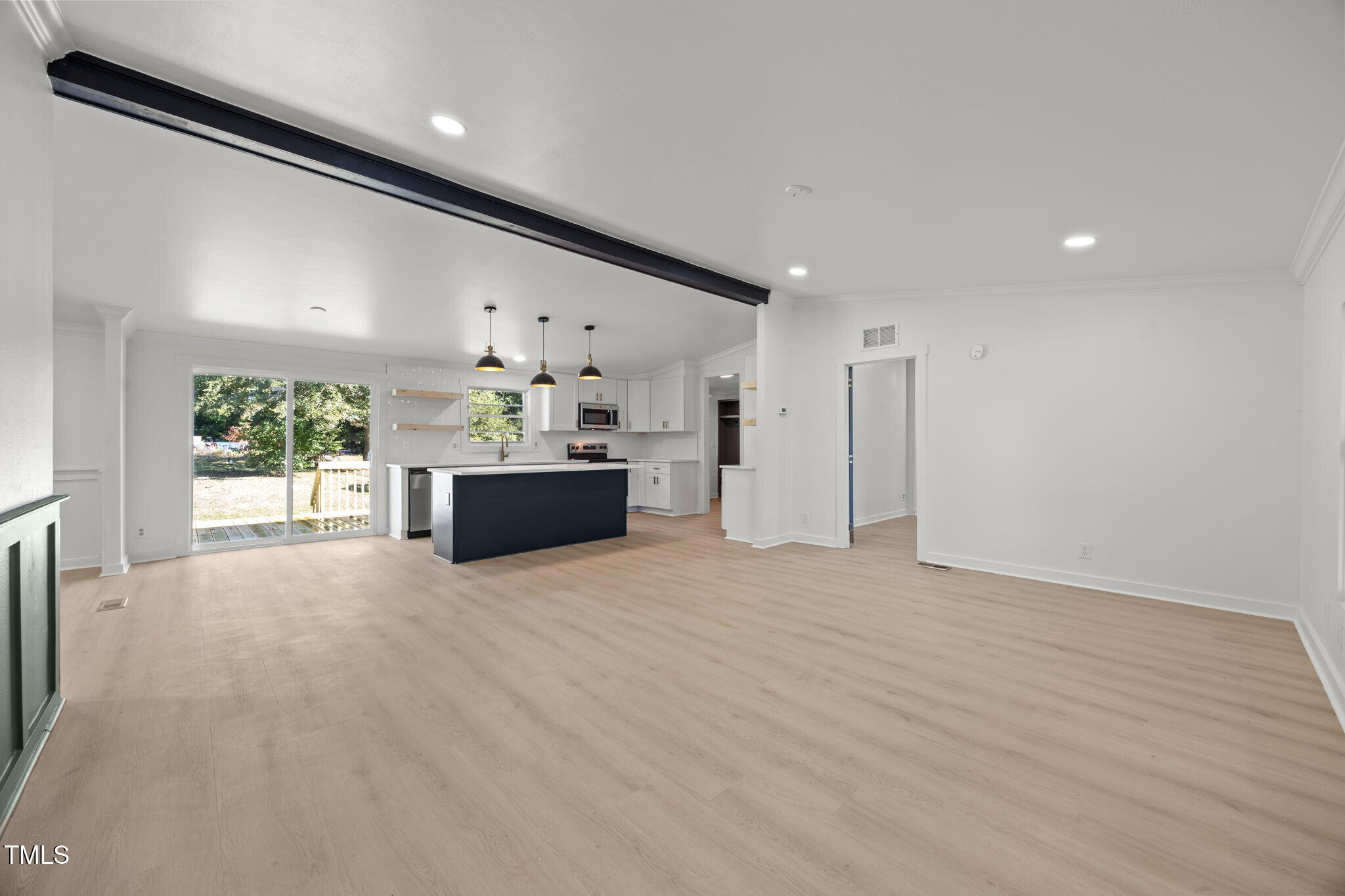 2309 Win Road Garner, NC 27529 - Photo 4 of 35 a view of a kitchen with a sink and a refrigerator