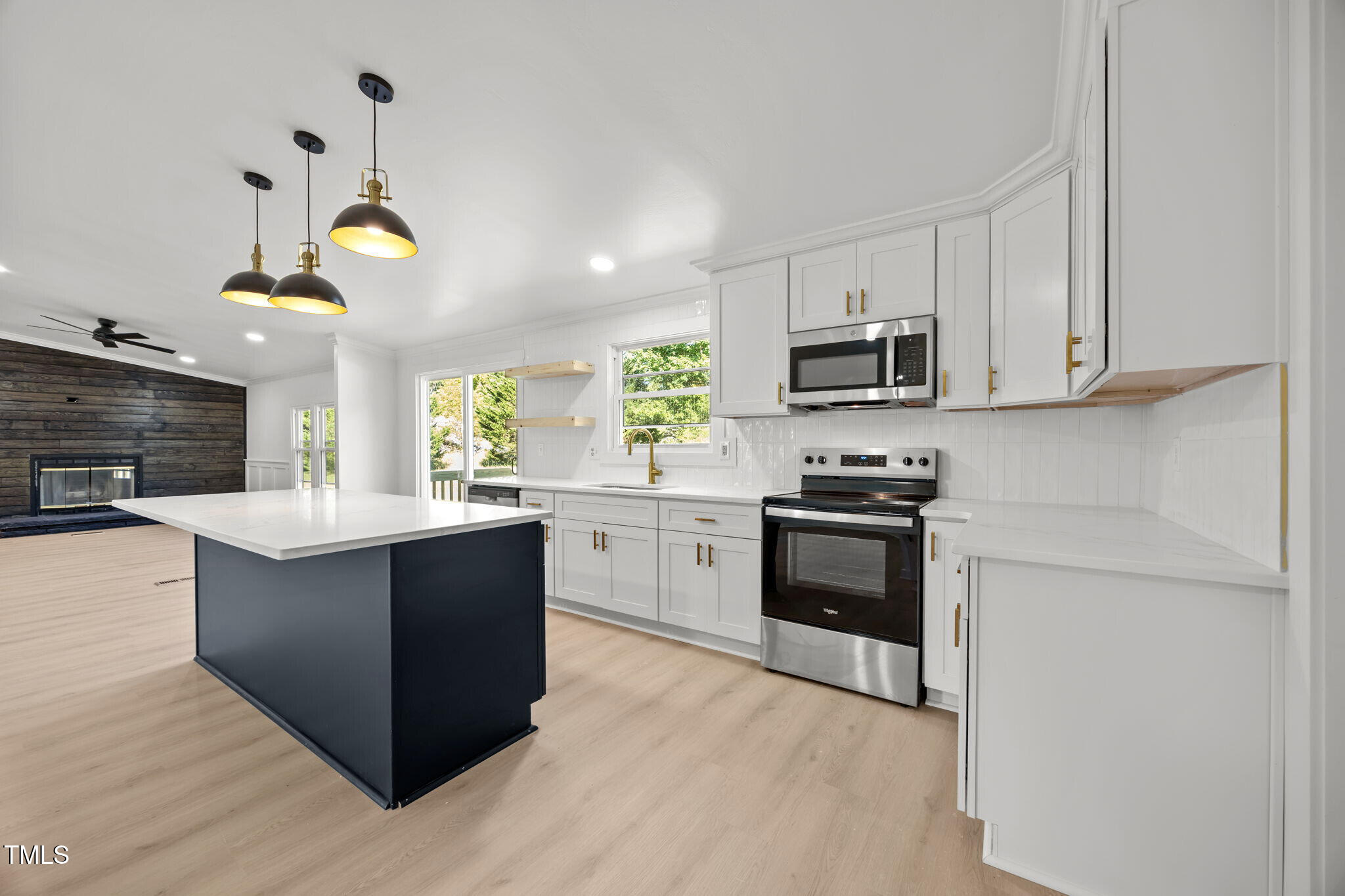2309 Win Road Garner, NC 27529 - Photo 8 of 35 a kitchen with stainless steel appliances granite countertop a stove a sink and a microwave
