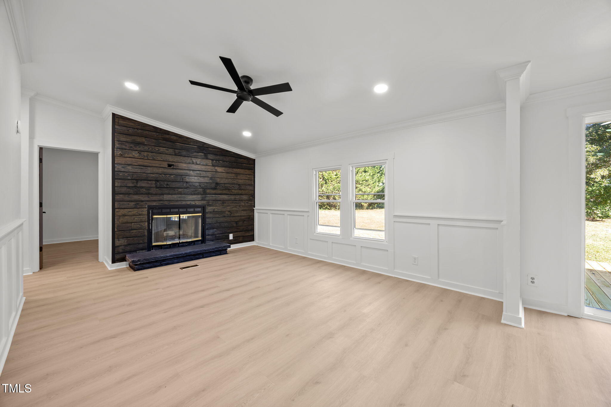 2309 Win Road Garner, NC 27529 - Photo 9 of 35 a view of empty room with a fireplace and windows