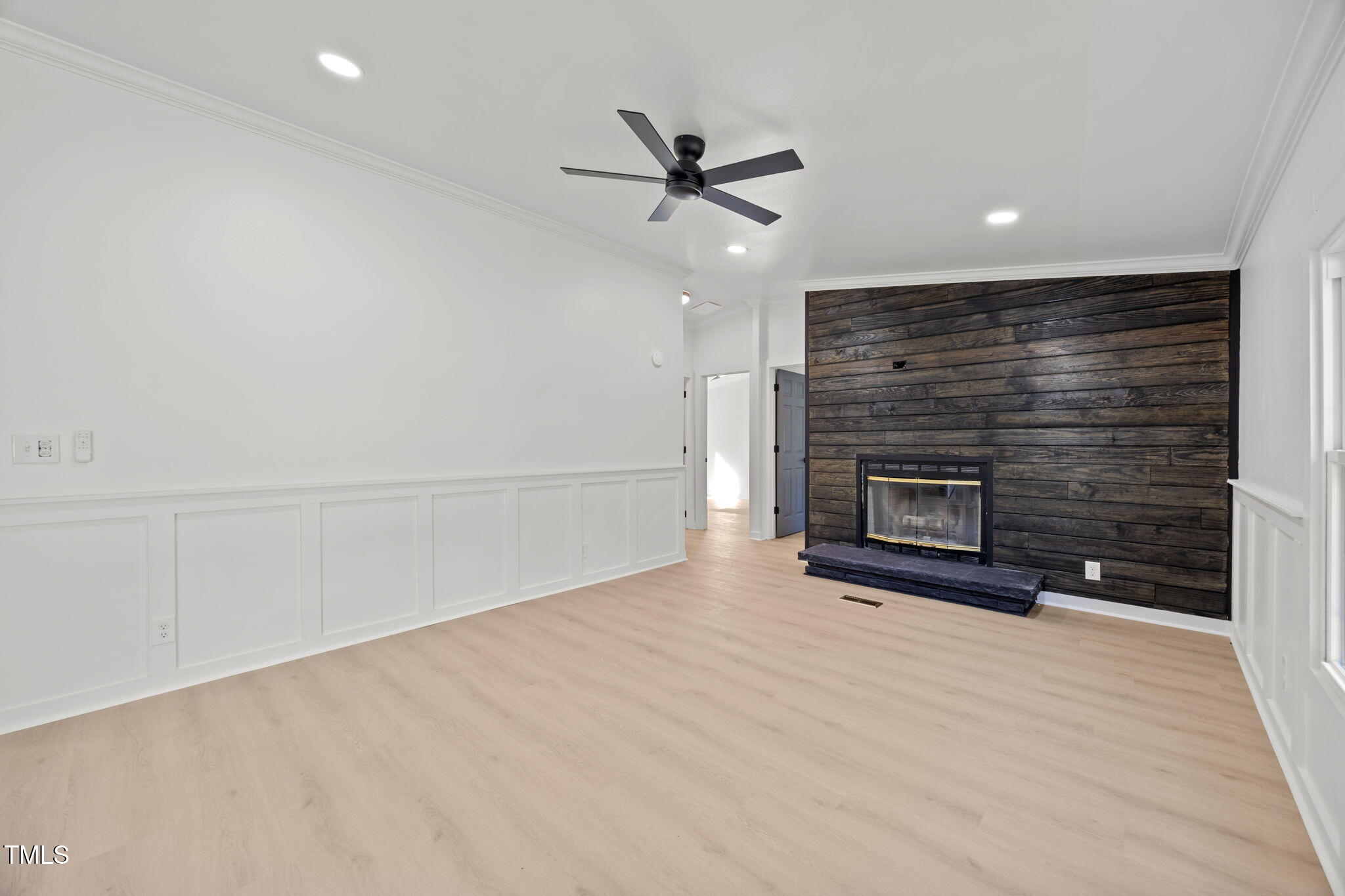 2309 Win Road Garner, NC 27529 - Photo 10 of 35 an empty room with windows and fireplace