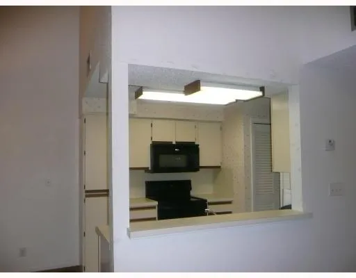 a living room with a flat screen tv and a fireplace