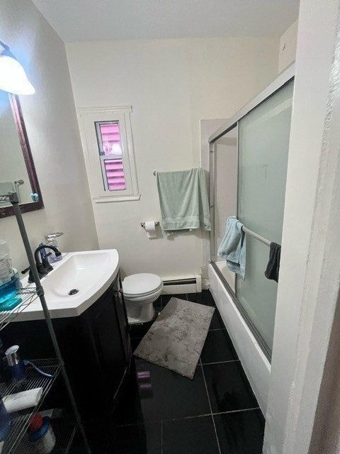 1576 Tremont Street, Unit 2 Boston, MA 02120 - Photo 12 of 13 a bathroom with a toilet a sink and mirror