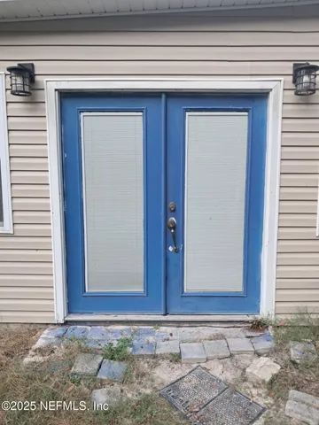 a couple of cars parked in front of a house