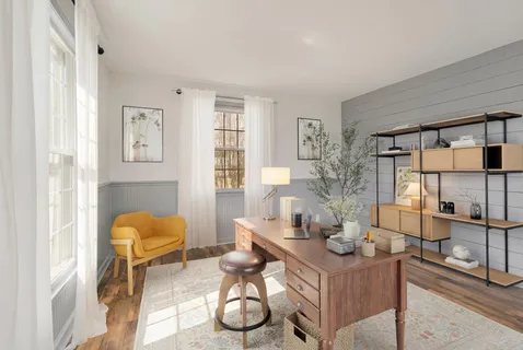 a living room with furniture and a table