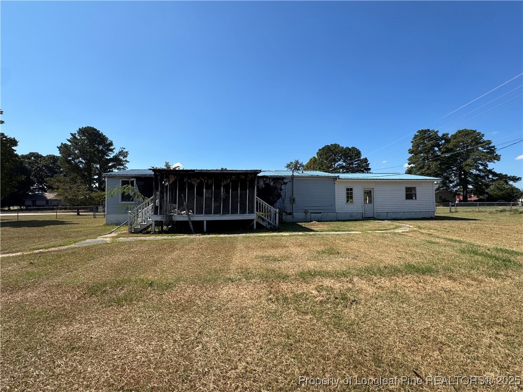 151 Ratley Street Raeford, NC 28376 - Photo 12 of 25 a view of a big yard with wooden fence