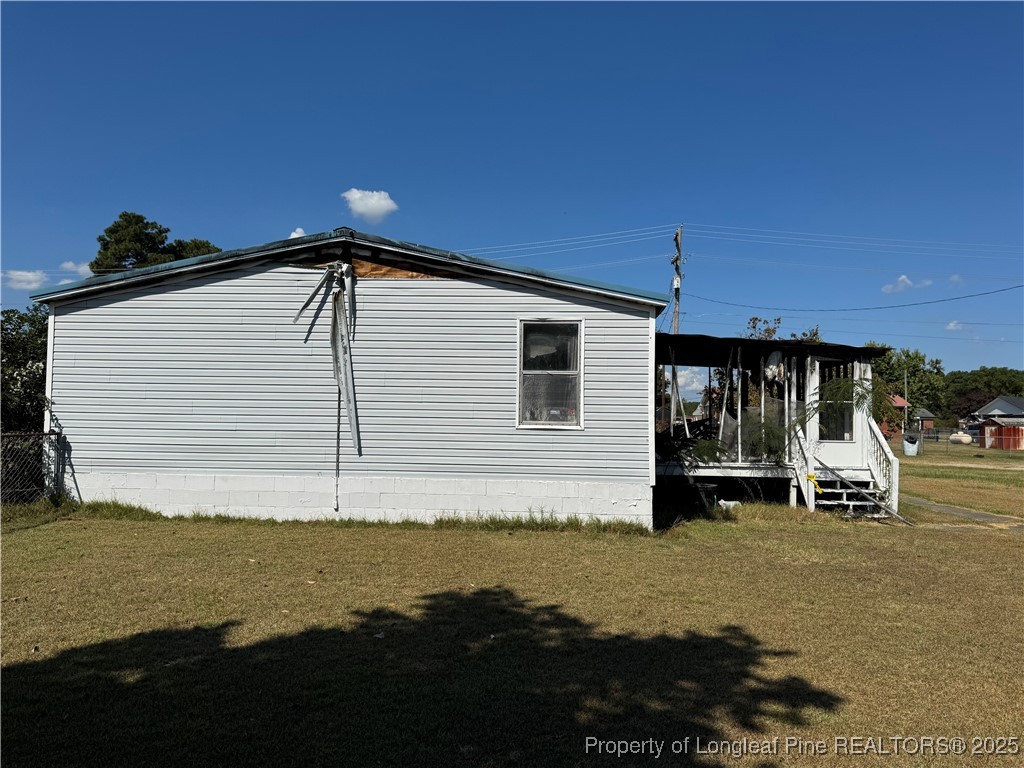 151 Ratley Street Raeford, NC 28376 - Photo 15 of 25 a house view with a garden space