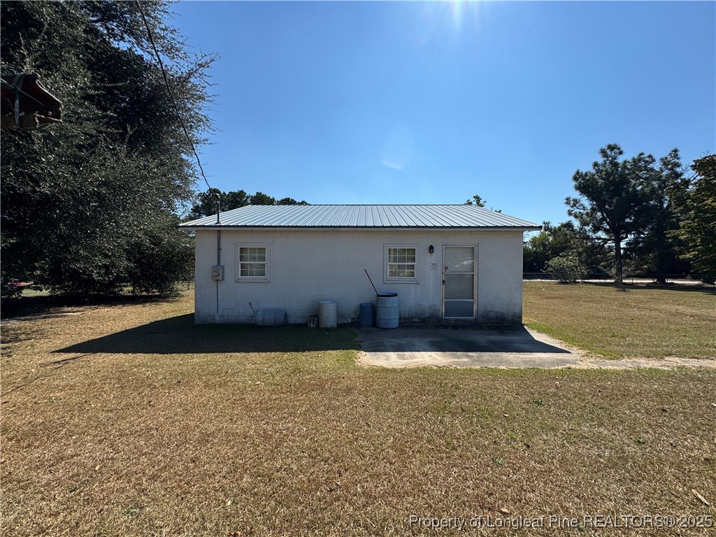 151 Ratley Street Raeford, NC 28376 - Photo 16 of 25 a view of a house with backyard and trees