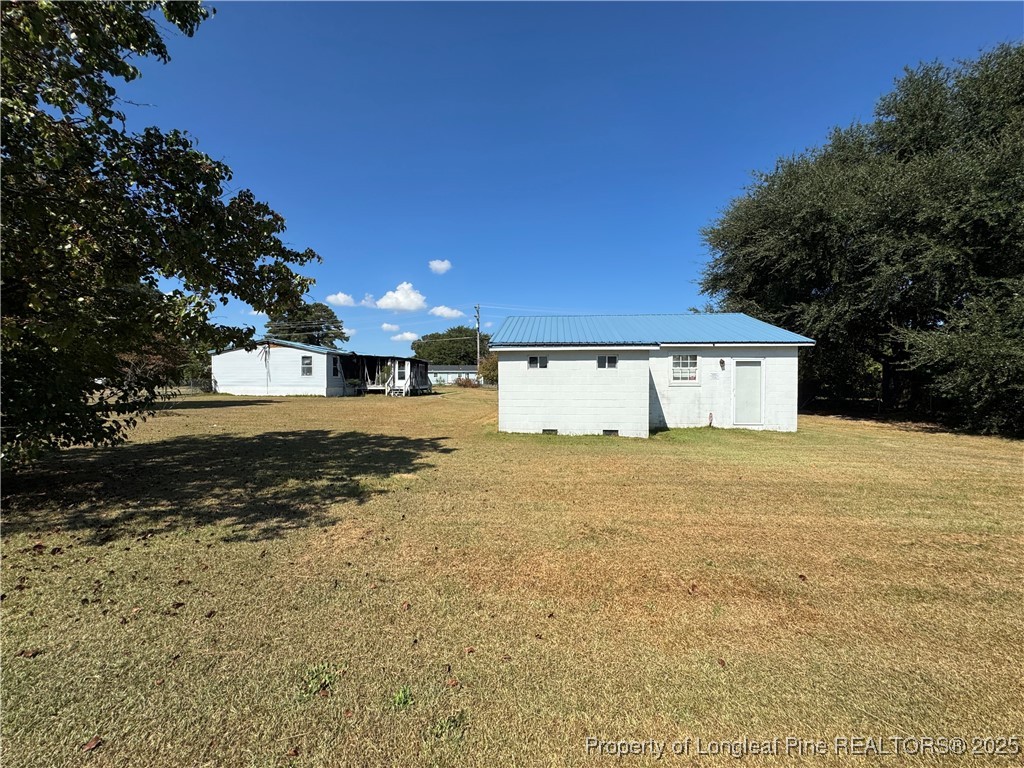 151 Ratley Street Raeford, NC 28376 - Photo 25 of 25 a view of a house with a yard