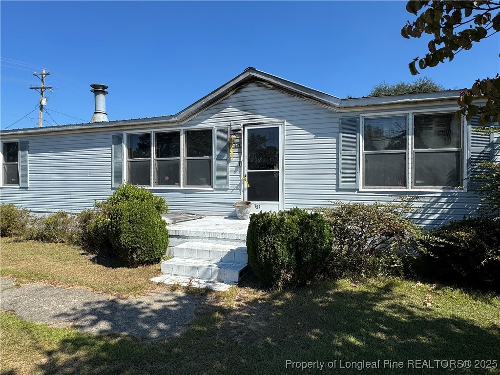 151 Ratley Street Raeford, NC 28376 - Photo 6 of 25 a front view of a house with a yard