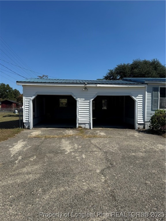 151 Ratley Street Raeford, NC 28376 - Photo 9 of 25 a front view of a house with a yard and garage