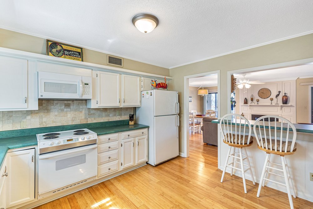 21 Harbor Gate Anderson, SC 29625 - Photo 17 of 44 This open concept kitchen offers ample storage and seamlessly connects to the living area.