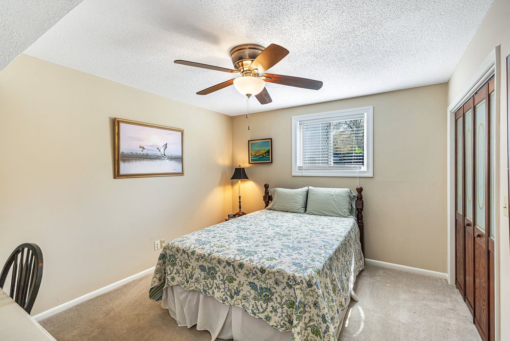 21 Harbor Gate Anderson, SC 29625 - Photo 22 of 44 This cozy bedroom offers a tranquil retreat with soft lighting and comfortable carpeting.