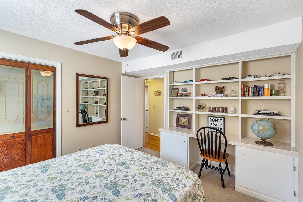21 Harbor Gate Anderson, SC 29625 - Photo 23 of 44 This cozy bedroom features a practical built-in desk and shelving, perfect for a dedicated workspace.