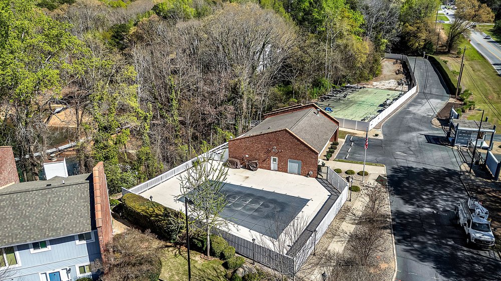 21 Harbor Gate Anderson, SC 29625 - Photo 37 of 44 An aerial view showcases a vibrant community recreation area with a fenced pool, club house and storage for boat trailers