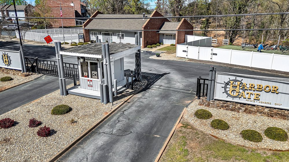 21 Harbor Gate Anderson, SC 29625 - Photo 38 of 44 Secure community entrance featuring a gatehouse and signage for exclusive access.