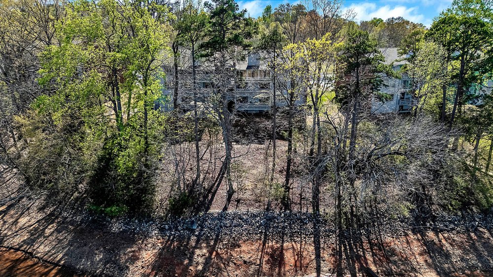 21 Harbor Gate Anderson, SC 29625 - Photo 42 of 44 This scenic property is nestled amidst lush trees, offering a private and serene natural setting.