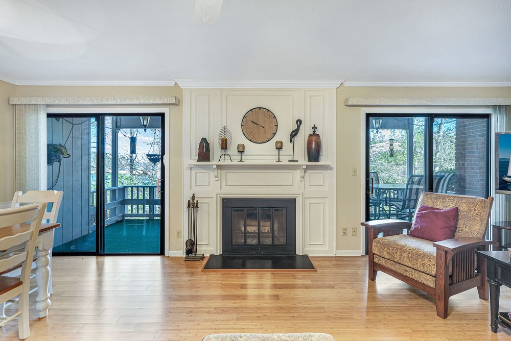 21 Harbor Gate Anderson, SC 29625 - Photo 9 of 44 This inviting living area boasts rich hardwood floors and a cozy fireplace, perfect for relaxation.