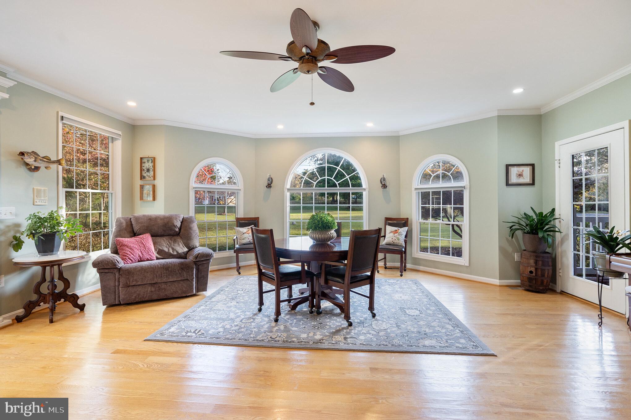 1965 Kings Landing Road Huntingtown, MD 20639 - Photo 19 of 46 Front of house great room area, access to porch.