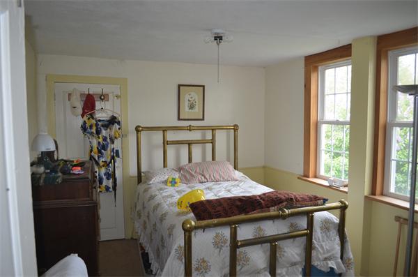 21 South Road Sturbridge, MA 01566 - Photo 27 of 30 a bed room with a bed mirror and a window