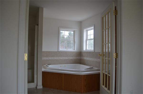 21 South Road Sturbridge, MA 01566 - Photo 9 of 30 a bathroom with a sink and a mirror