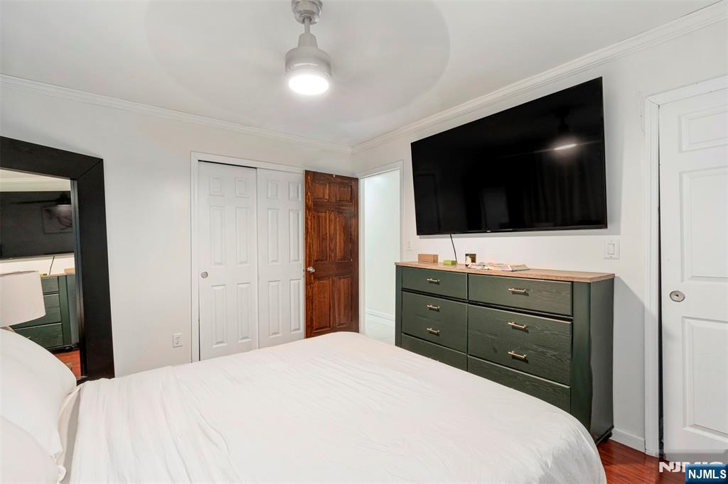88 Hinchman Avenue Wayne, NJ 07470 - Photo 13 of 37 a bedroom with a bed and a flat screen tv