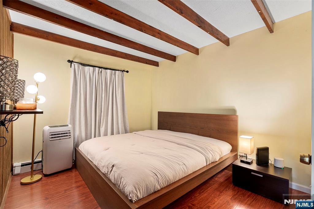 88 Hinchman Avenue Wayne, NJ 07470 - Photo 14 of 37 a bedroom with a bed and a night stand