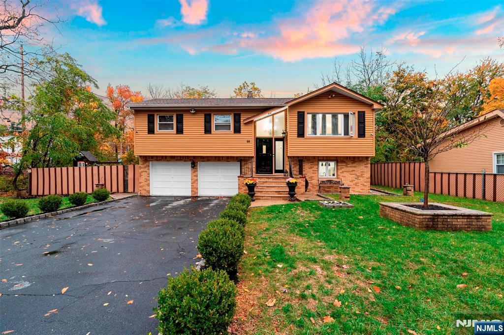 88 Hinchman Avenue Wayne, NJ 07470 - Photo 2 of 37 a front view of a house with garden