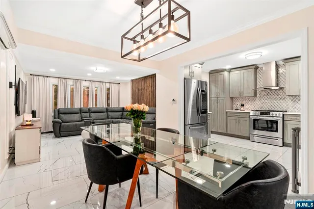 a kitchen with stainless steel appliances kitchen island granite countertop a sink and cabinets
