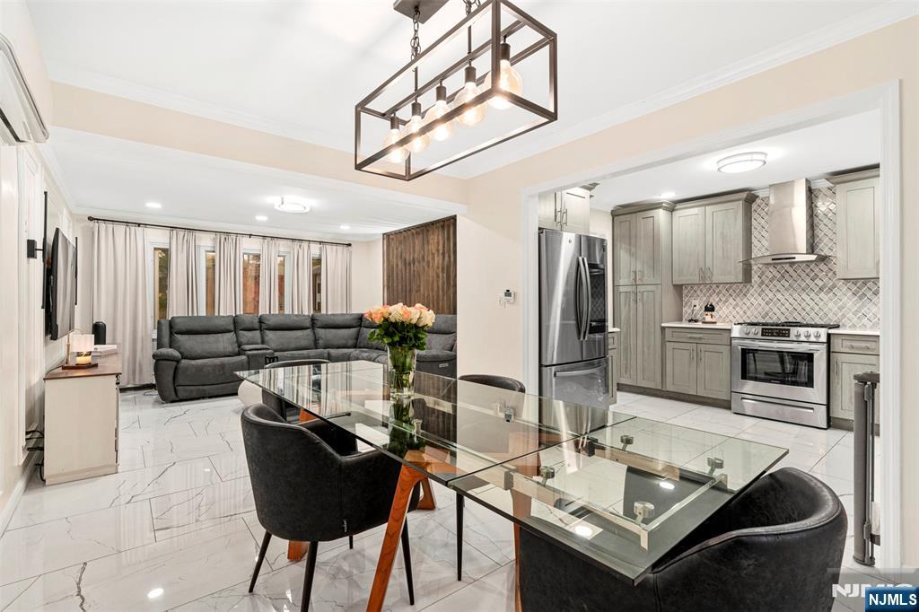 88 Hinchman Avenue Wayne, NJ 07470 - Photo 3 of 37 a kitchen with stainless steel appliances kitchen island granite countertop a sink and cabinets