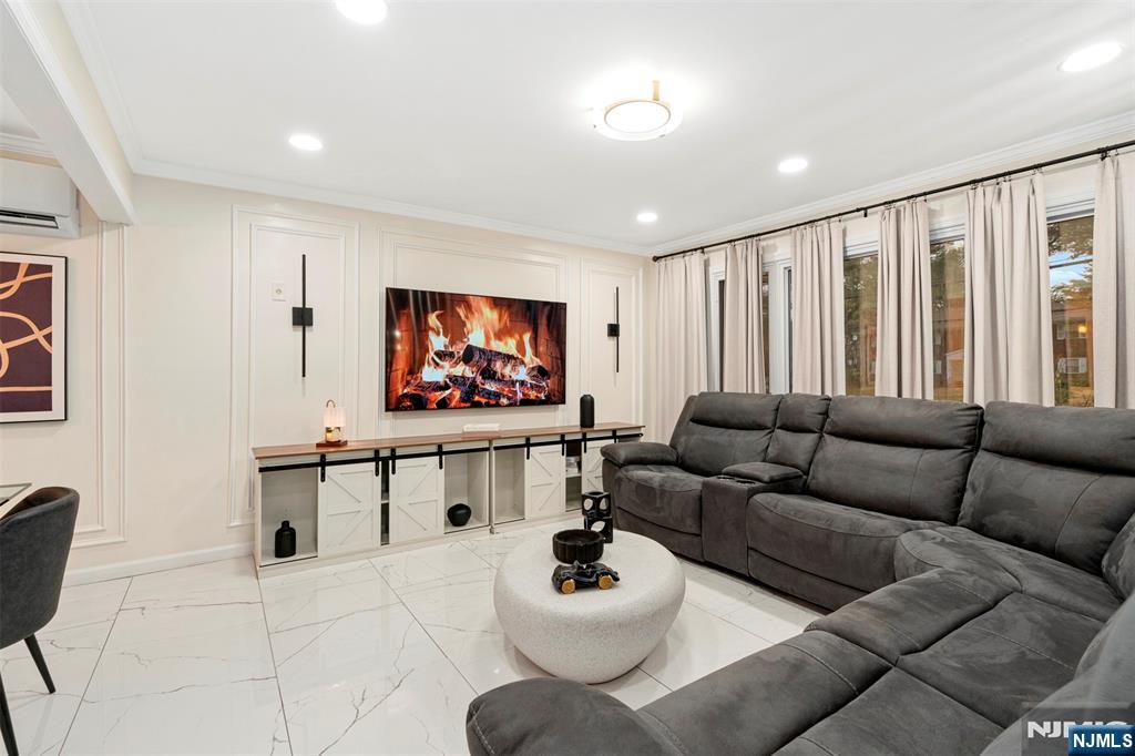 88 Hinchman Avenue Wayne, NJ 07470 - Photo 5 of 37 a living room with furniture and a flat screen tv