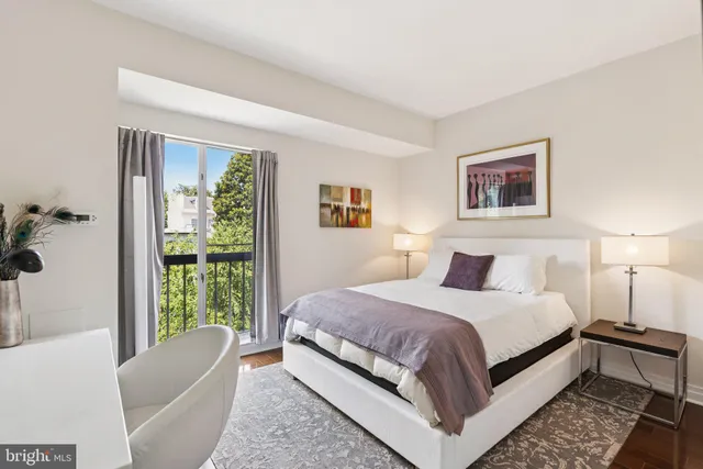 a bedroom with a large bed and a couch