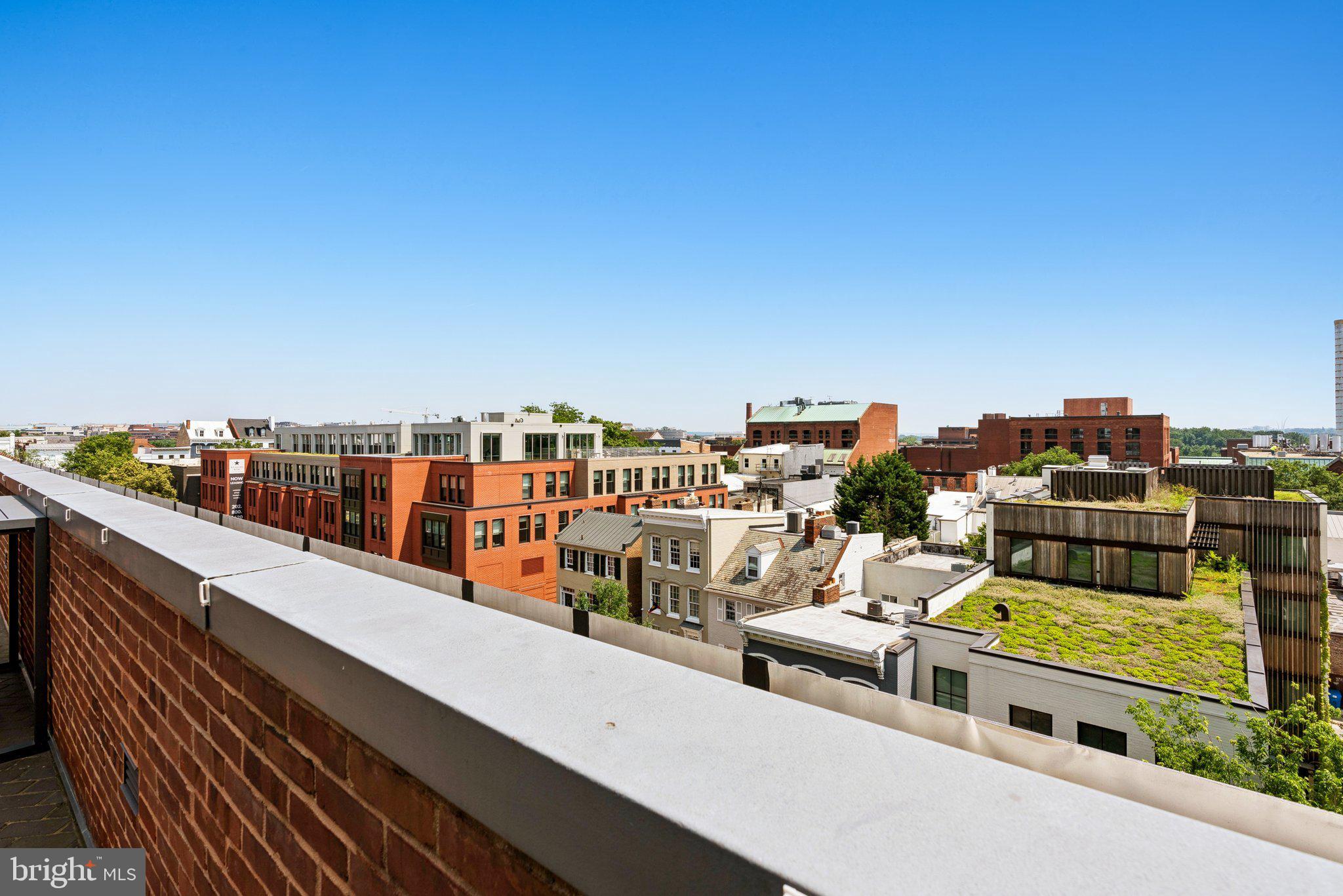 3251 Prospect Street Northwest, Unit 402 Washington, DC 20007 - Photo 28 of 36 a view of city from balcony with seating area