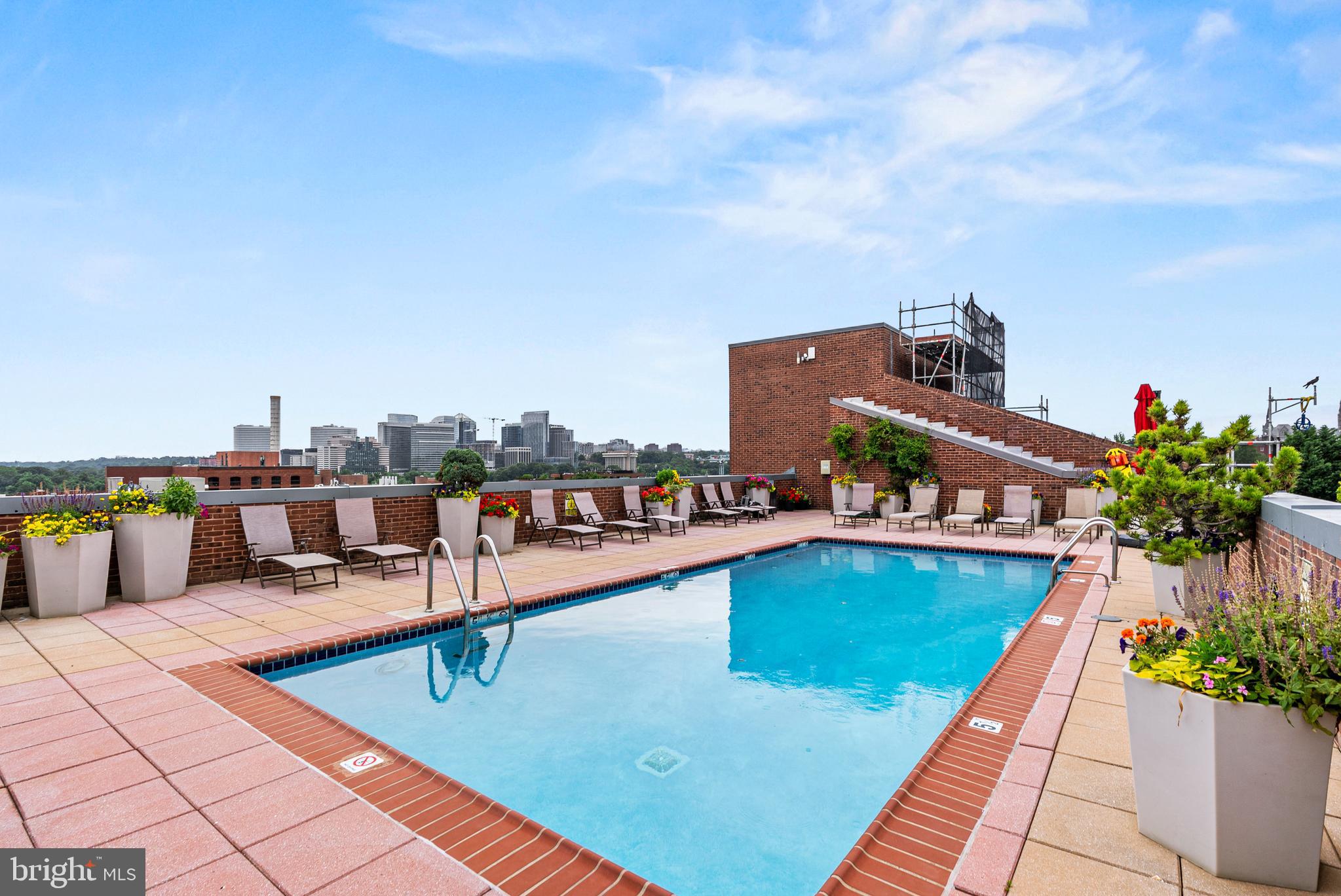 3251 Prospect Street Northwest, Unit 402 Washington, DC 20007 - Photo 30 of 36 a view of a swimming pool with a lounge chair