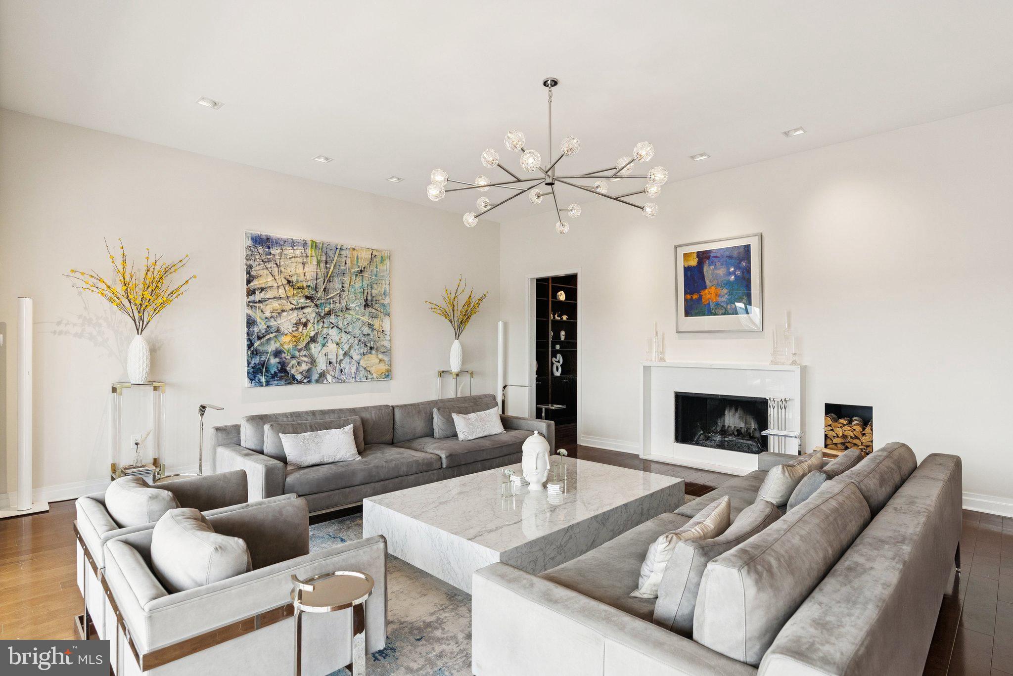3251 Prospect Street Northwest, Unit 402 Washington, DC 20007 - Photo 4 of 36 a living room with furniture and a fireplace