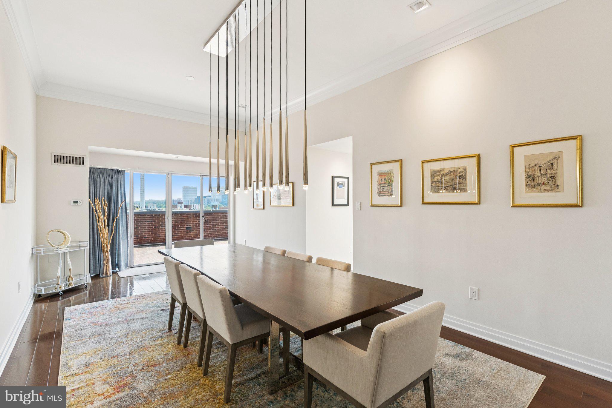 3251 Prospect Street Northwest, Unit 402 Washington, DC 20007 - Photo 6 of 36 a view of a dining room with furniture and wooden floor