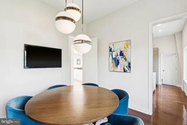 a view of a livingroom with furniture and wooden floor