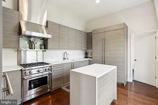a kitchen with a stove and a microwave