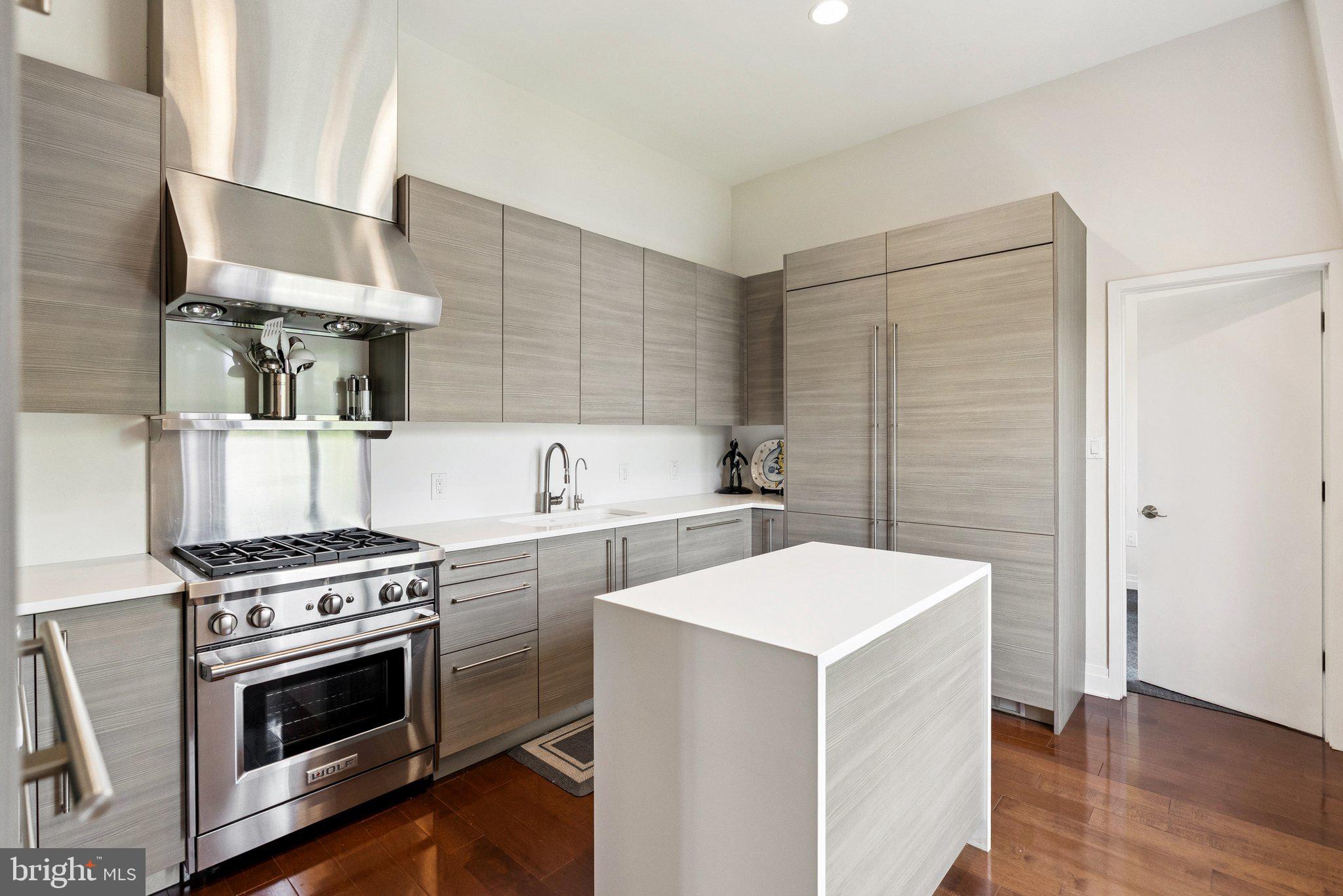 3251 Prospect Street Northwest, Unit 402 Washington, DC 20007 - Photo 9 of 36 a kitchen with a stove and a microwave