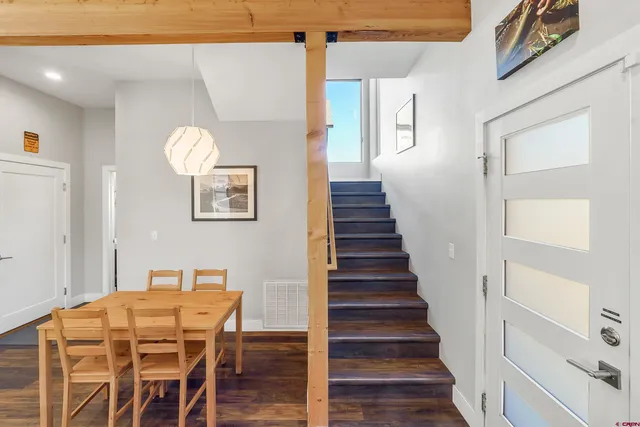 a bedroom with a bed and a large mirror