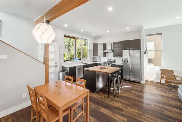 a view of a dining room with furniture window and wooden floor